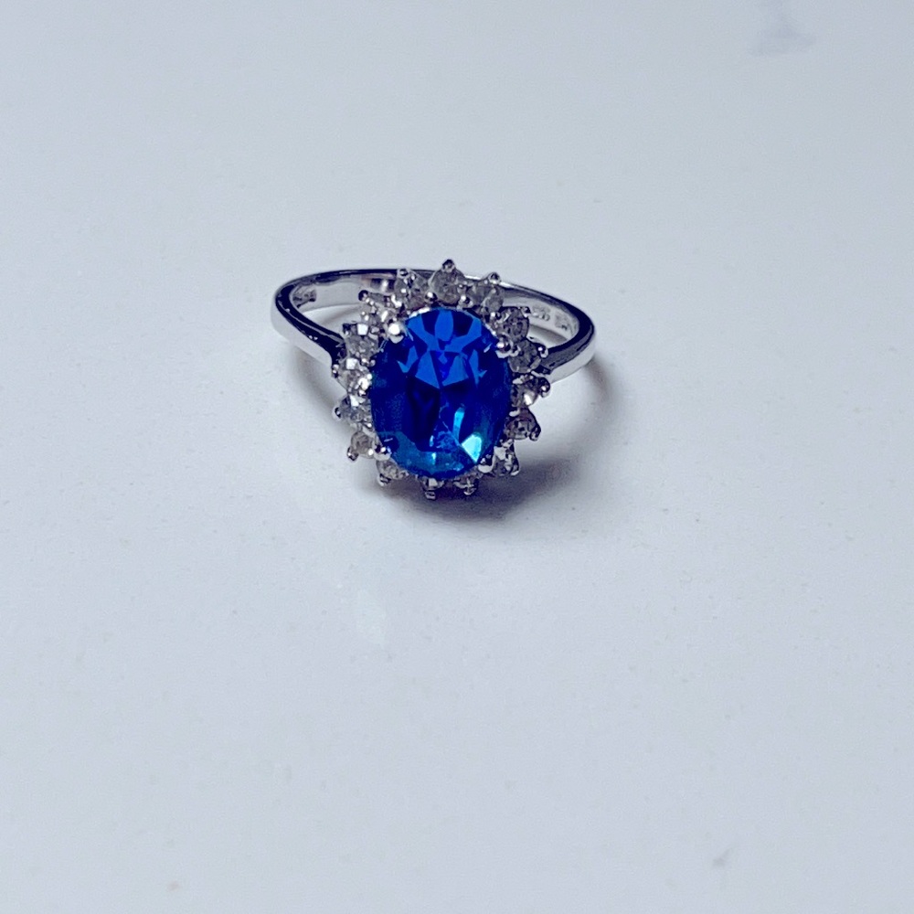 Blue oval stone halo silver ring